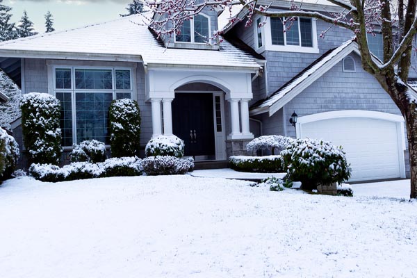 image of a house in winter that uses oil heat for home heating
