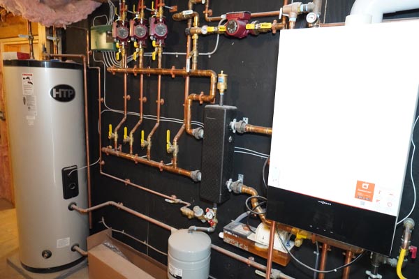 image of a boiler that is experiencing water leaking from boiler system