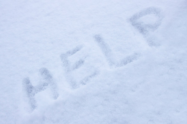 the word help in snow depicting forgetting to schedule a heating fuel delivery