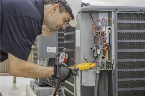 HVAC technician performing an AC tune-up