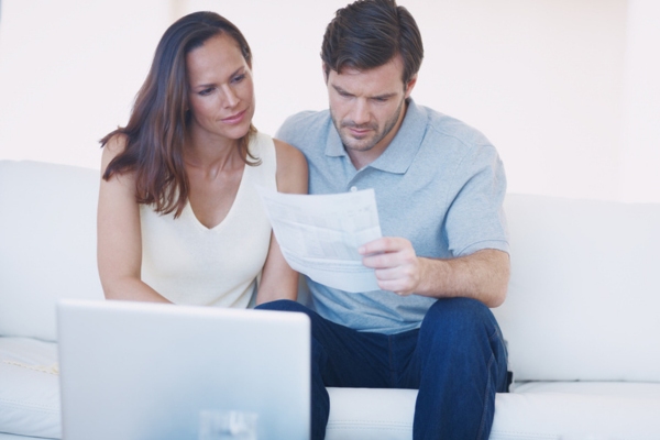 couple looking stressed due to high energy bills
