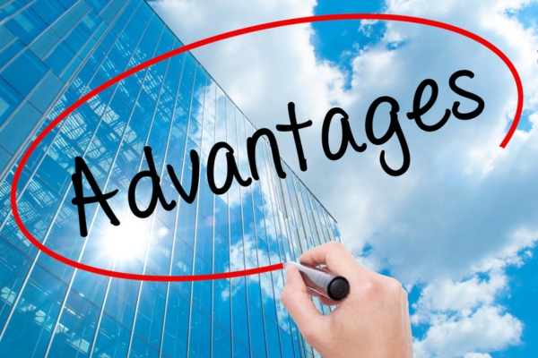 advantages written using marker with building and clouds in the background depicting double-wall home heating oil tank