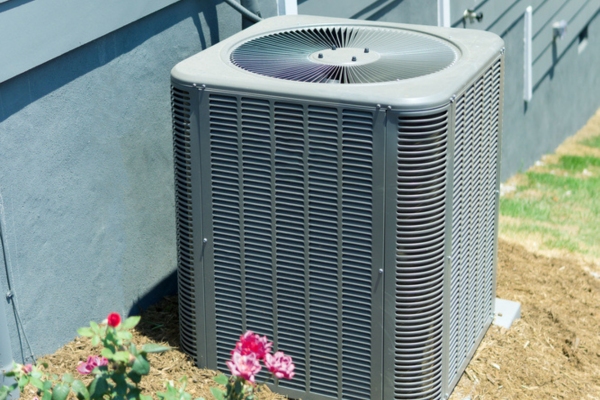 residential air conditioner unit set up outside the house