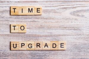 time to upgrade written using wooden blocks depicting air conditioning system