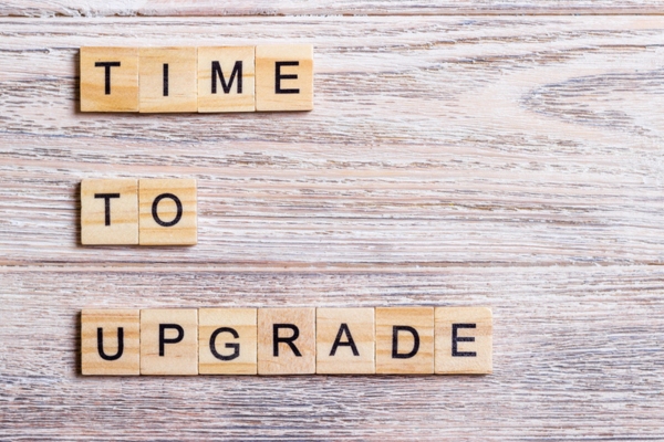 time to upgrade written using wooden blocks depicting air conditioning system