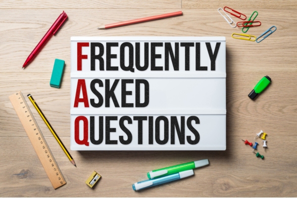 frequently asked questions written on a lightbox depicting boiler FAQs