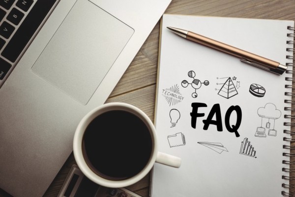 FAQ doodle on notepad next to coffee and laptop depicting fuel delivery questions