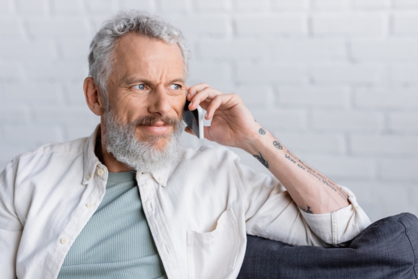 Man on the phone depicting benefits of will call fuel oil delivery