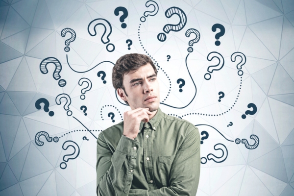 image of a thinking man surrounded by question marks depicting heating oil FAQs