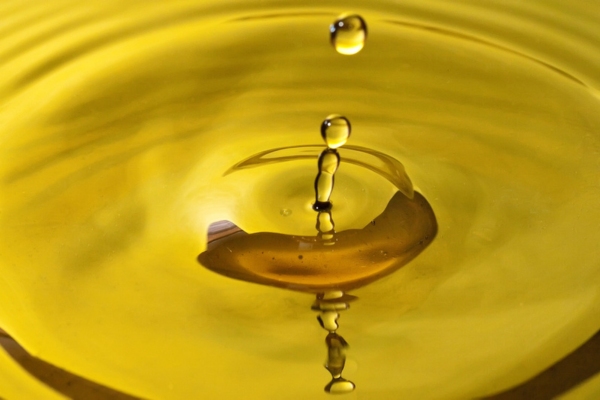 liquid gold drop depicting oil refining process