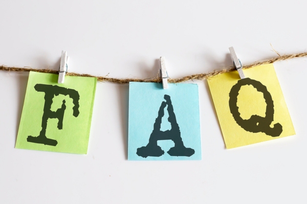 FAQ on colored paper hanging on a thin rope depicting questions about oil furnace