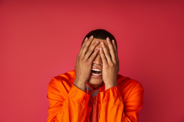 man covering his face depicting oil furnace reset button not working