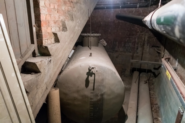 old heating oil tank installed in a basement
