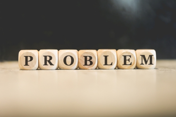 problem spelled using wooden letter cubes depicting reset button of oil furnace