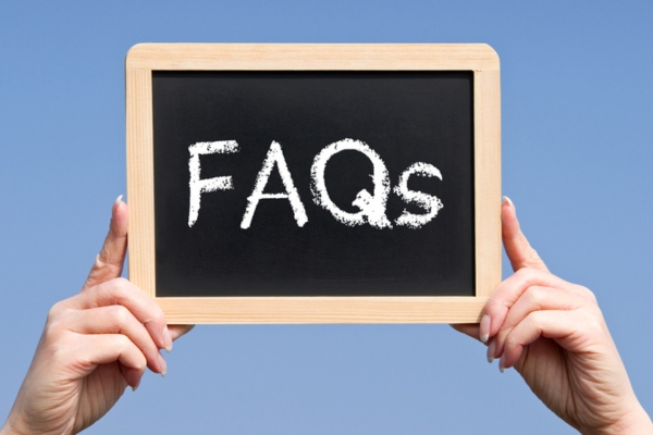 FAQs written on a mini chalkboard depicting air conditioner care