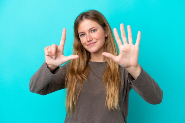 blonde woman holding 7 fingers up depicting HVAC maintenance tips