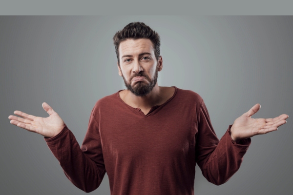 man looking at the camera and shrugging depicting difference between AFUE and AFUE2