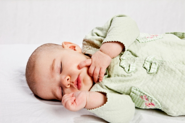baby sleeping soundly due to quiet operation of ductless AC