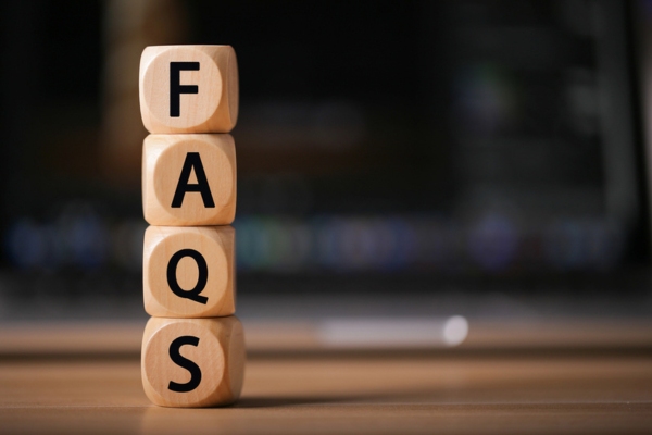 FAQS spelled using wooden letter dice depicting questions about ducted vs ductless air conditioning systems