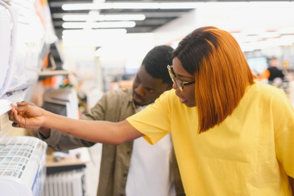 couple choosing air conditioner at the store
