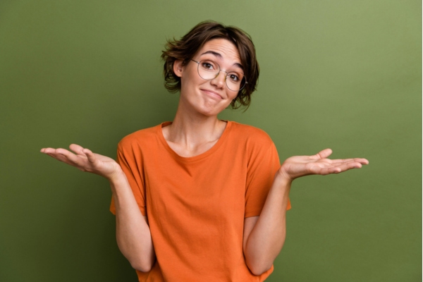 woman with two hands on the side depicting choosing between ducted vs ductless air conditioning systems