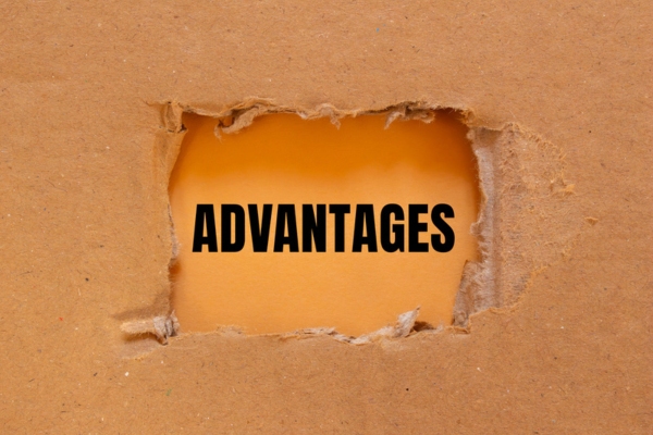 Advantages written on ripped torn cardboard paper depicting boiler