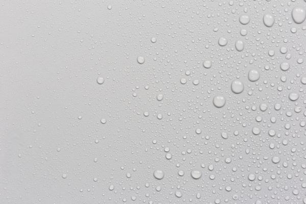 water droplets on a gray background depicting condensation