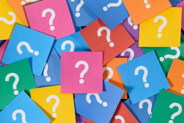 question marks on colorful papers depicting FAQs about heating oil additives