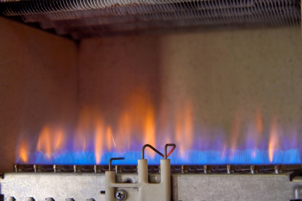 blue and orange flame from a furnace burner
