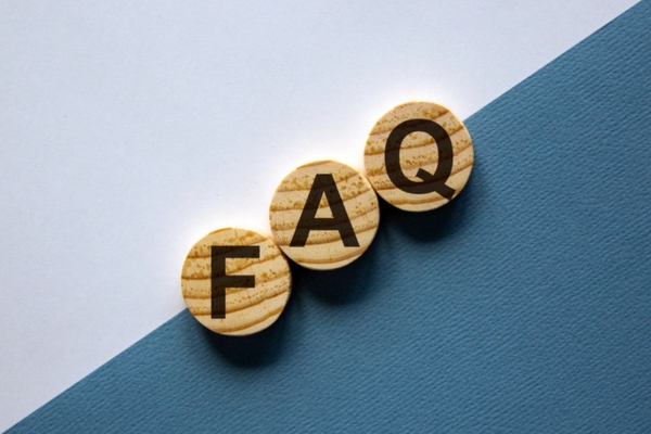 FAQ spelled using circular wooden letter chips depicting Energy Efficient Heating System questions
