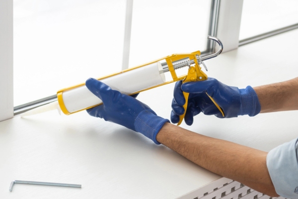 worker sealing windows