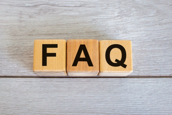 FAQ spelled using wooden letter cubes depicting AC Unit Isn’t Blowing Cold Air questions