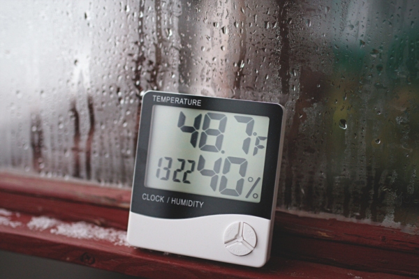 hygrometer and thermometer measuring humidity and temperature of a home