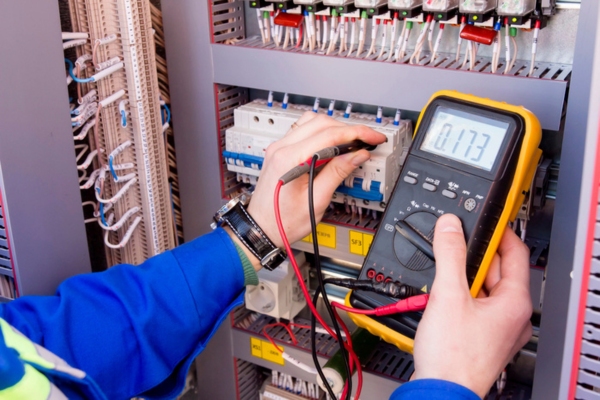 electrician examining home electrical panel