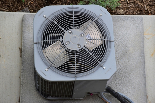 top view of a central air conditioner installed outside the house